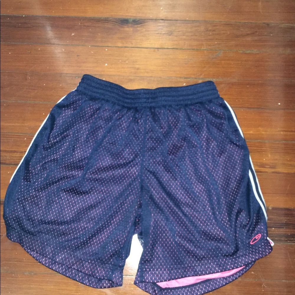 Blue and pink women’s small basketball shorts.